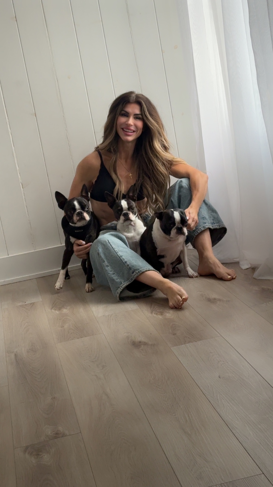 Mandy at home with her three Boston Terriers